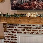 A fall garland on a fireplace mantle.