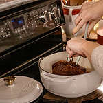 A women pulling apart a fajita beef roast