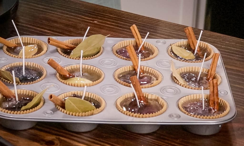 easy homemade fire starters in a muffin tin on a wooden counter top in a cottage kitchen
