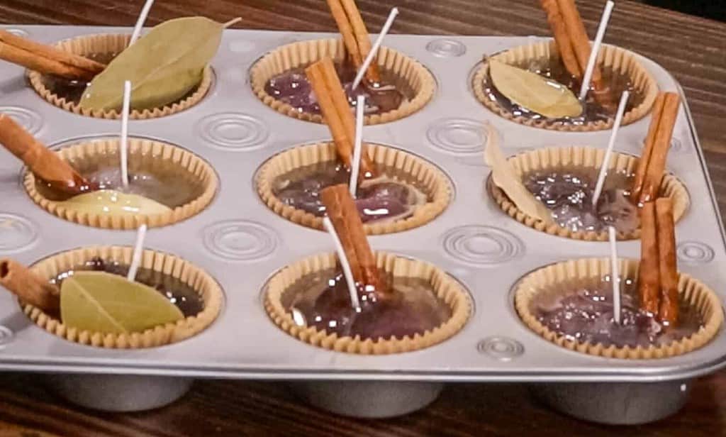 easy homemade fire starters in a muffin tin on a wooden counter top in a cottage kitchen