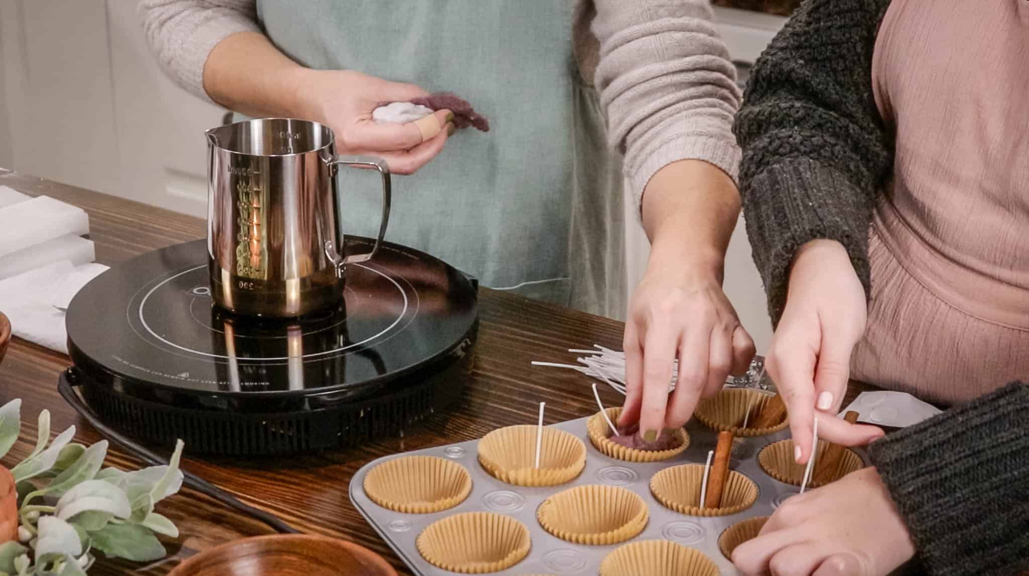 a women placing dryer lint into lined muffin tin