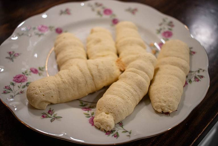 A plate of lady finger cookies for serving later.