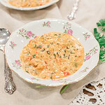 Creamy shrimp and crawfish étouffée served in a floral bowl, a classic New Orleans–style Cajun dish