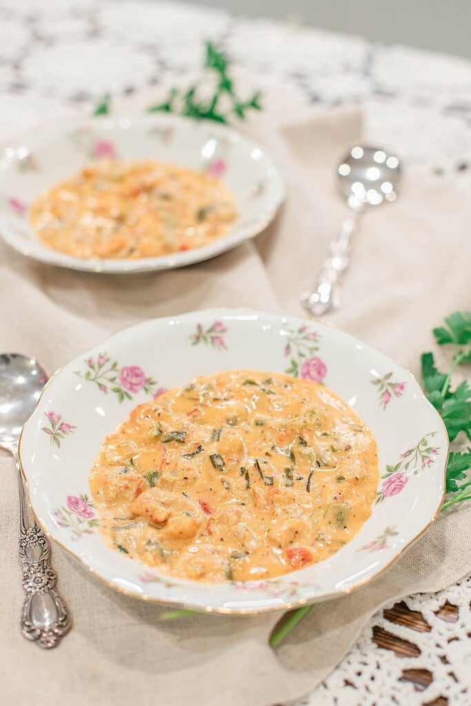 Creamy shrimp and crawfish étouffée served in a floral bowl, a classic New Orleans–style Cajun dish