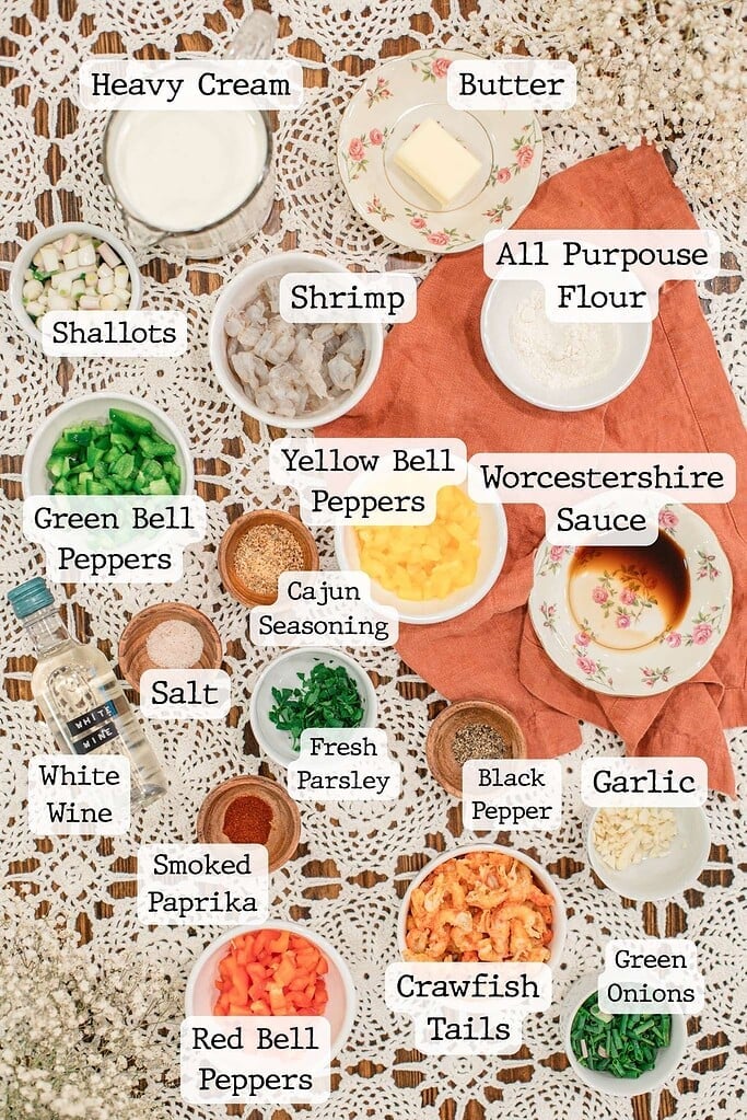 Ingredients for a shrimp and crawfish étouffée recipe including shrimp, crawfish tails, peppers, cream, butter, and Cajun seasoning