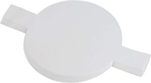A stack of round parchment paper liners with side tabs, used for lining baking pans to prevent sticking and ease cake removal.