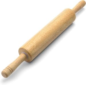 A classic wooden rolling pin with smooth handles—simple and timeless, perfect for gently crushing graham crackers for a cottage-style popsicle crust.