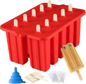 A bright red silicone popsicle mold filled with wooden sticks, accompanied by a blue funnel, extra sticks, and clear storage bags—ideal for crafting creamy homemade popsicles.