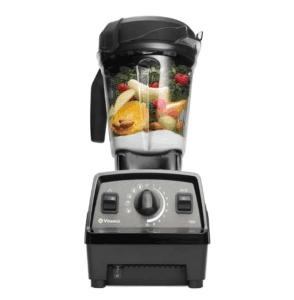 Vitamix Propel Series 750 blender filled with fresh ingredients including orange slices, banana, kale, raspberries, grapes, almonds, and yogurt, set against a white background.