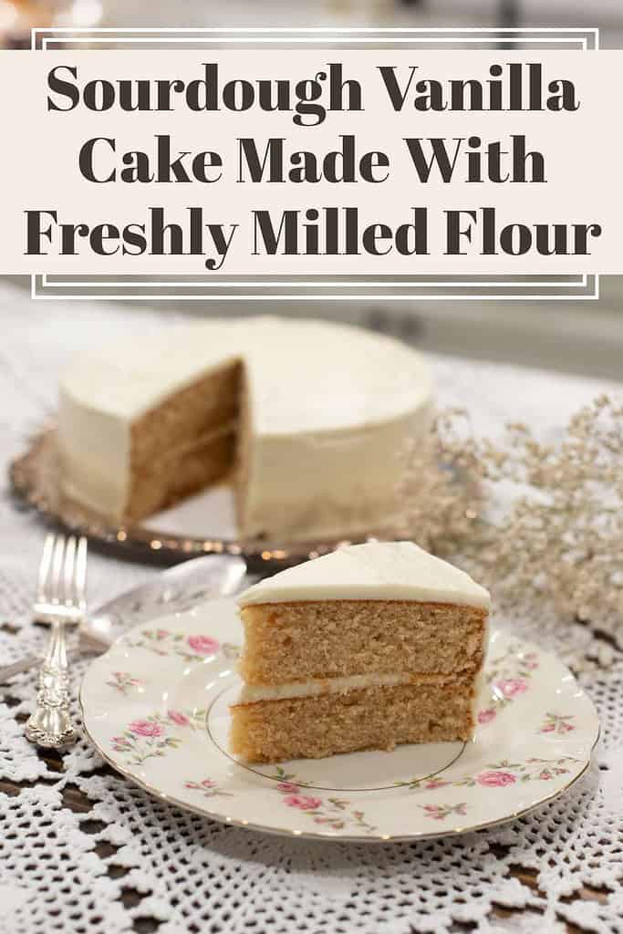 Pinterest graphic showing a slice of frosted sourdough vanilla cake made with freshly milled flour on a vintage floral plate, with the full cake in the background. Text overlay reads: Sourdough Vanilla Cake Made With Freshly Milled Flour.