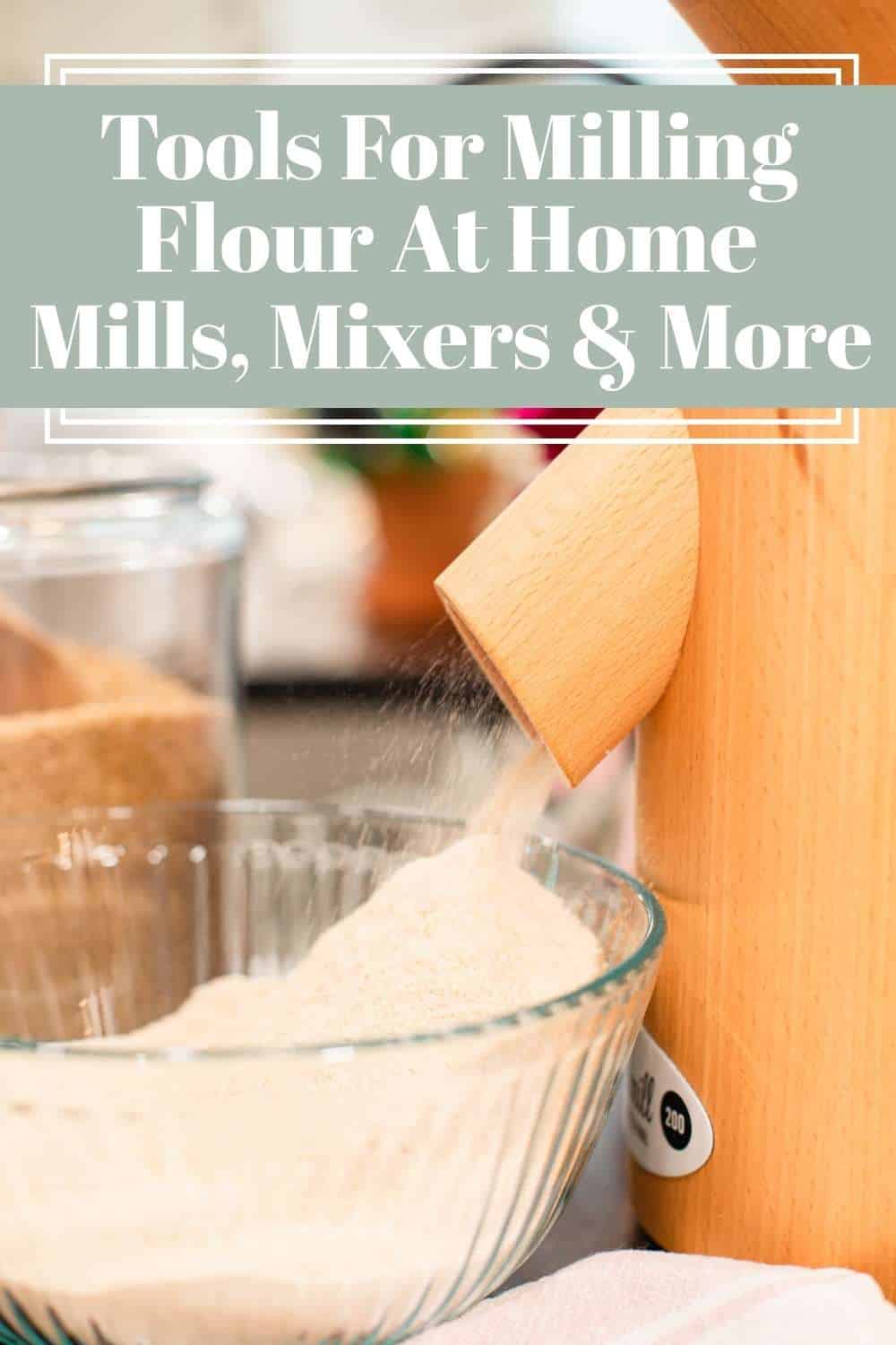 A wooden grain mill grinding flour into a glass bowl on a cozy kitchen counter.