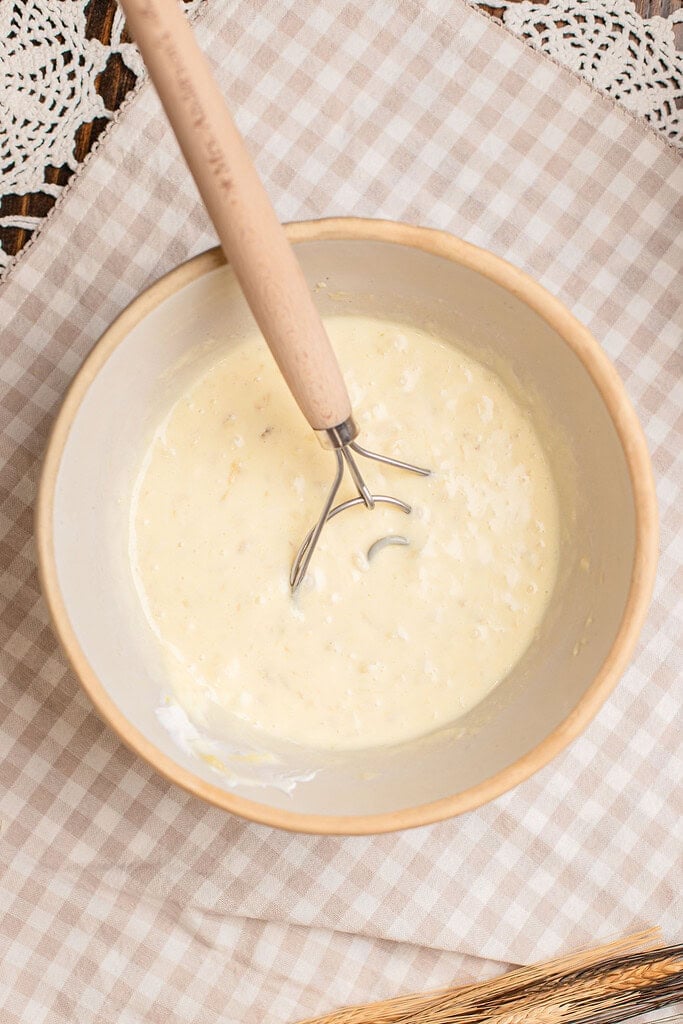 Wet ingredients whisked together for banana muffins with freshly milled flour batter