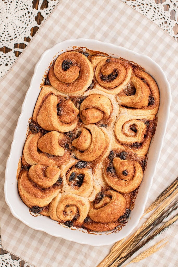 Freshly baked cinnamon rolls made with freshly milled flour in a white baking dish