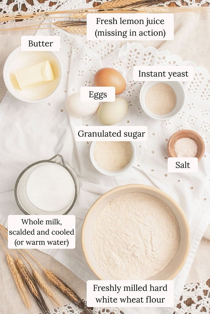 Ingredients for hot dog buns with freshly milled flour including butter, eggs, instant yeast, granulated sugar, salt, whole milk, and freshly milled hard white wheat flour, with fresh lemon juice noted as missing