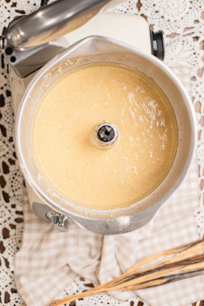 Smooth freshly milled flour batter fully blended in the mixer bowl, ready to pour into the pans