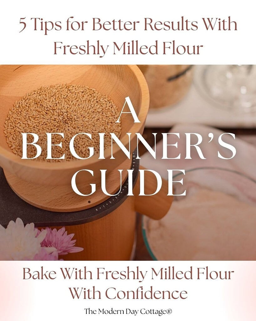 Cover of the 5 Tips for Better Results With Freshly Milled Flour beginnerโs guide from The Modern Day Cottage, featuring wheat berries and a grain mill.